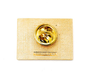 9-11 September 11, 2001 Collectible Commemorative Lapel Pin is designed with the tower skyline in front of red, white, and blue American flag details, with the words "Never Forget September 11, 2001" in gold letters. Made with a yellow gold jewelry-grade metal.